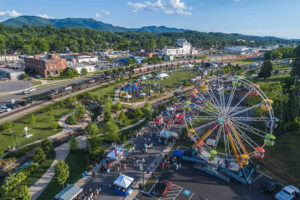 Photograph of ferris wheel and other attractions at the annual Blue Plum festival in Johnson City, TN